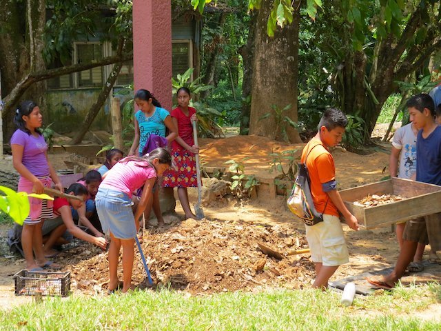 Kids in Casa Guatemala in Rio Dulce Helping to Clean Soil of Plastic Packaging They’d Thrown on the Ground (Emma Gallagher)