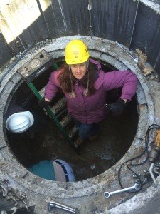 Kathy Puffer putting final touches on a Solar CITIES cement PUXIN biodigester that will process cow manure into a rich compost tea and biogas for heating a barn. 